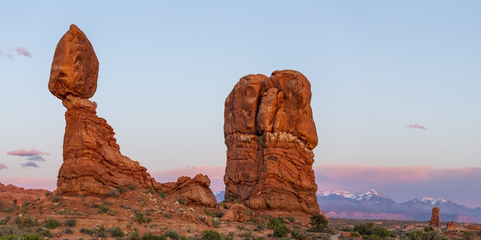 Iconic Balanced Rock formation at Arches under soft sky